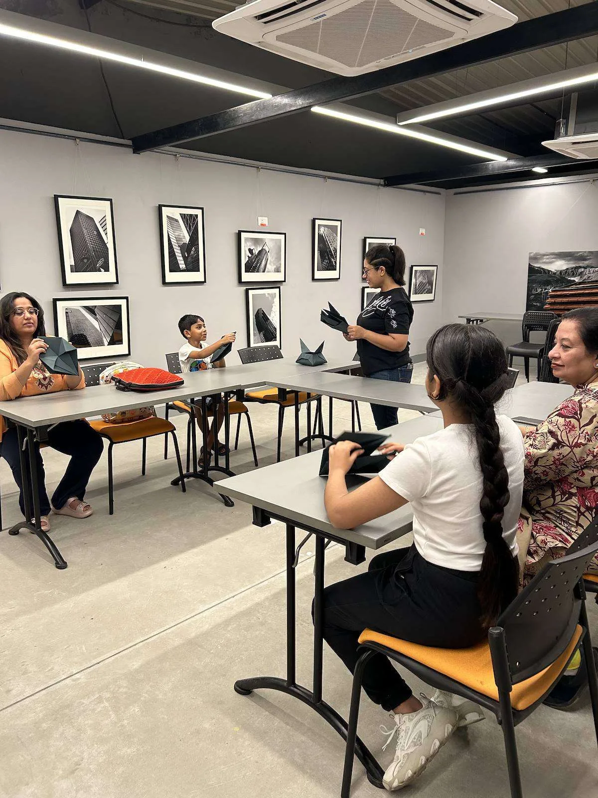 Families at the paper craft workshop at Museo Camera