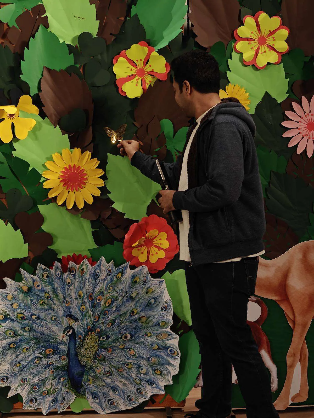 Paper peacock and camel jungle wall