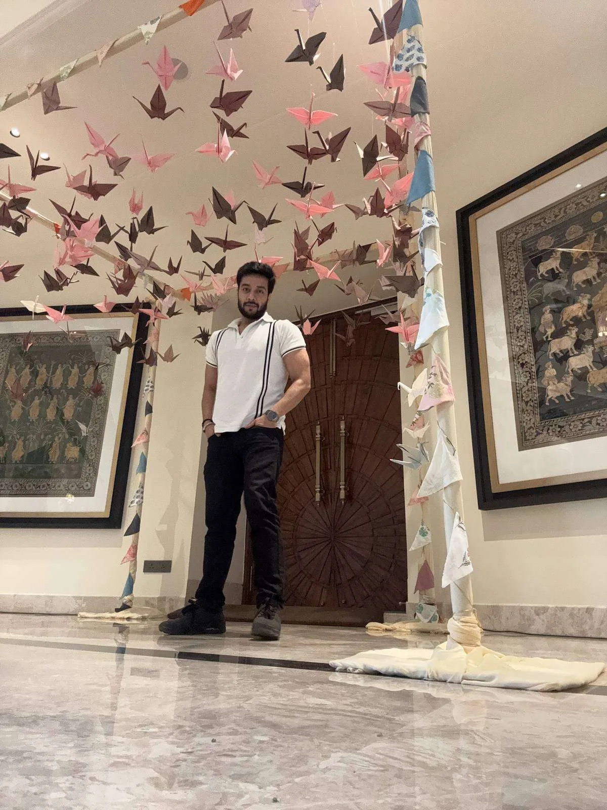 Origami bird installation in a gallery foyer