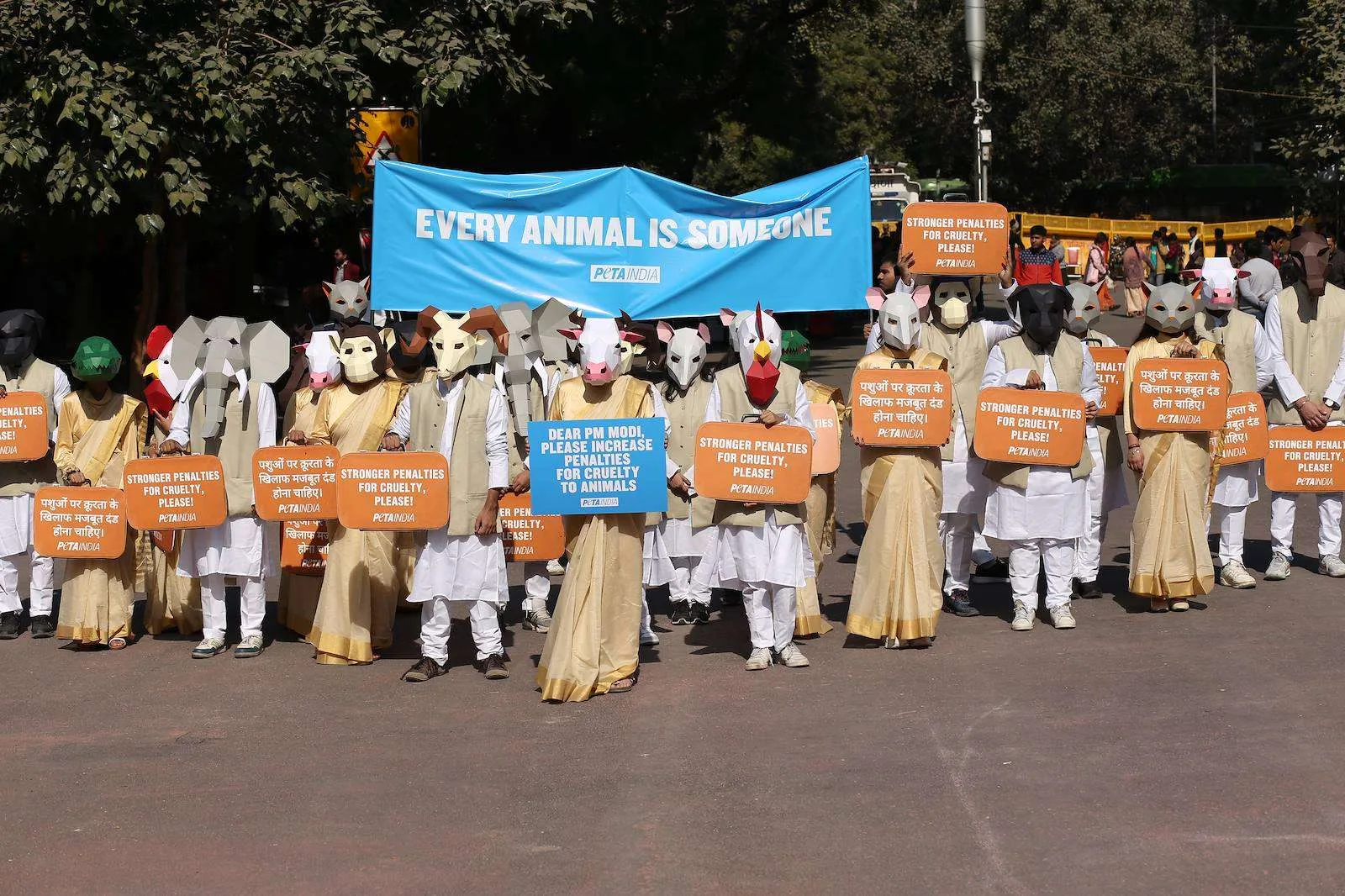 PETA India campaigners in paper animal masks with placards