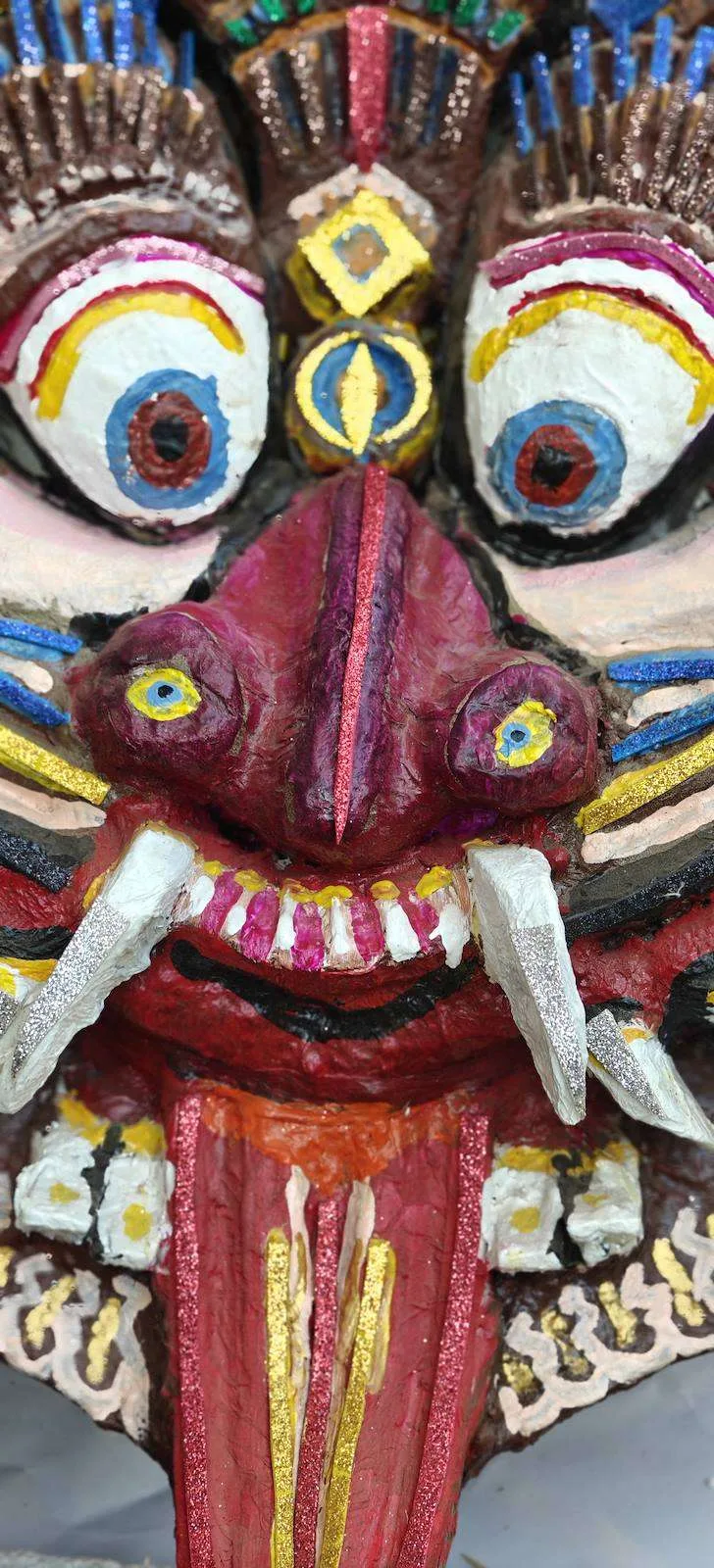 Close-up of the painted Kirtimukh face